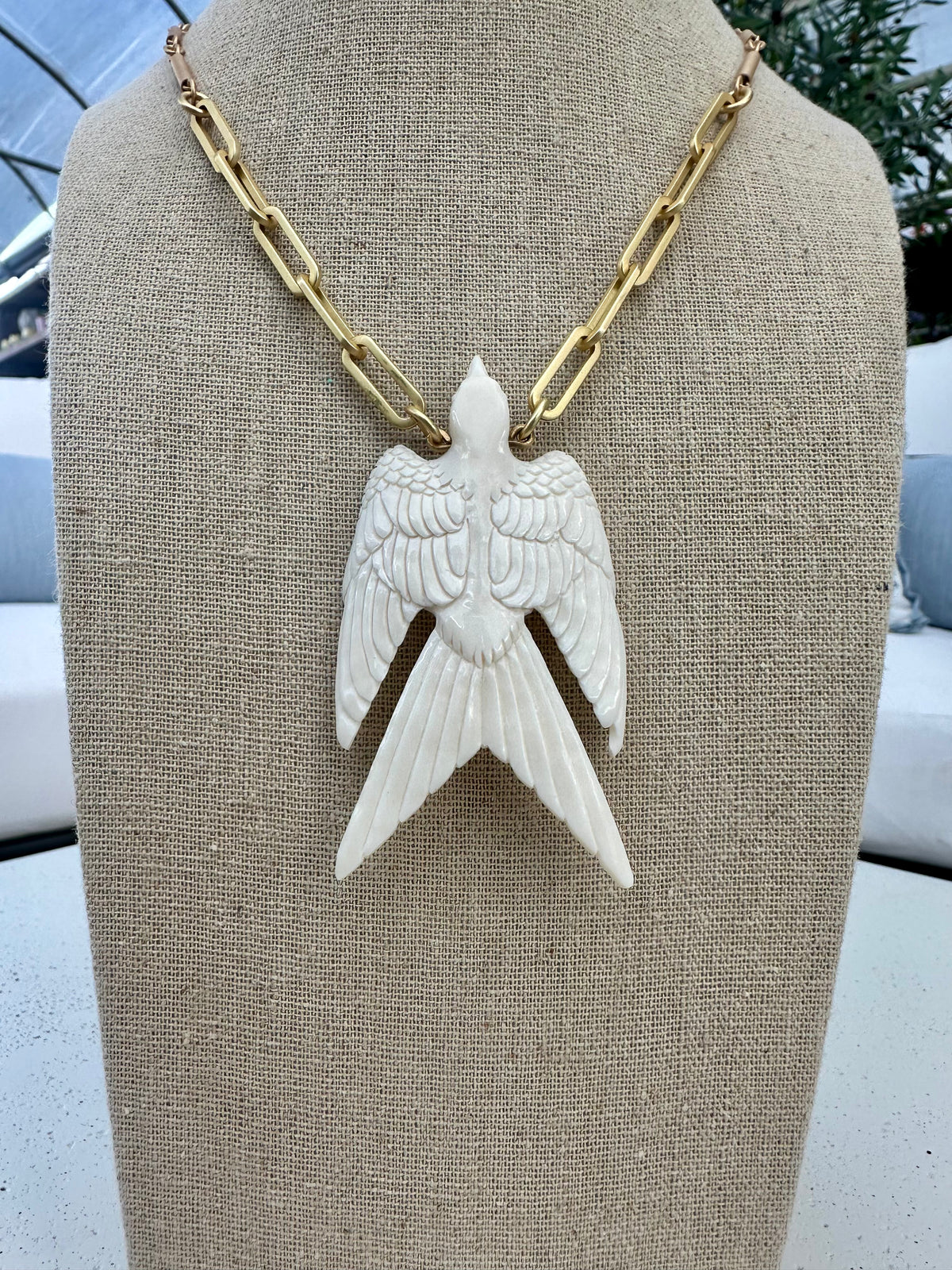 CARVED WHITE SPARROW NECKLACE