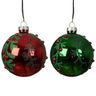 Two Christmas ornaments, one red and one green, with decorative elements on a white background.
