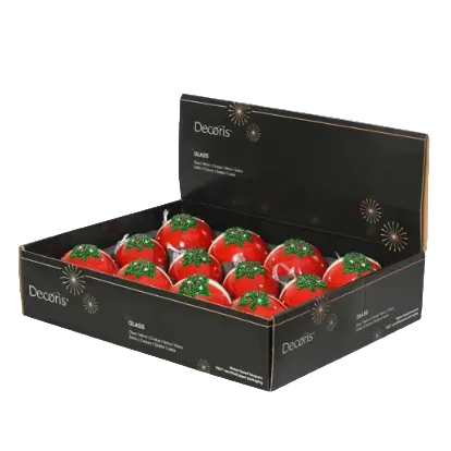An open black Decoris glass display box containing multiple red Christmas ornament-shaped glass decorations with green tops, photographed on a white background.