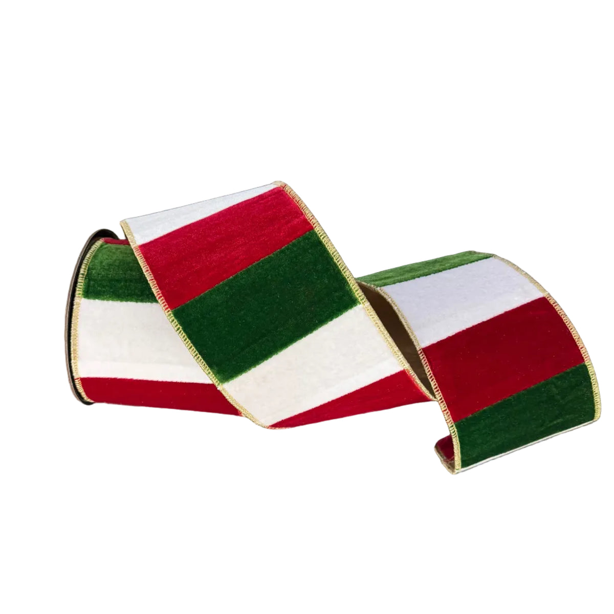 A roll of striped velvet ribbon in red, white, and green with a thin gold edge, coiled on a gray concrete floor.