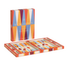 Colorful backgammon set with packaging on a white background