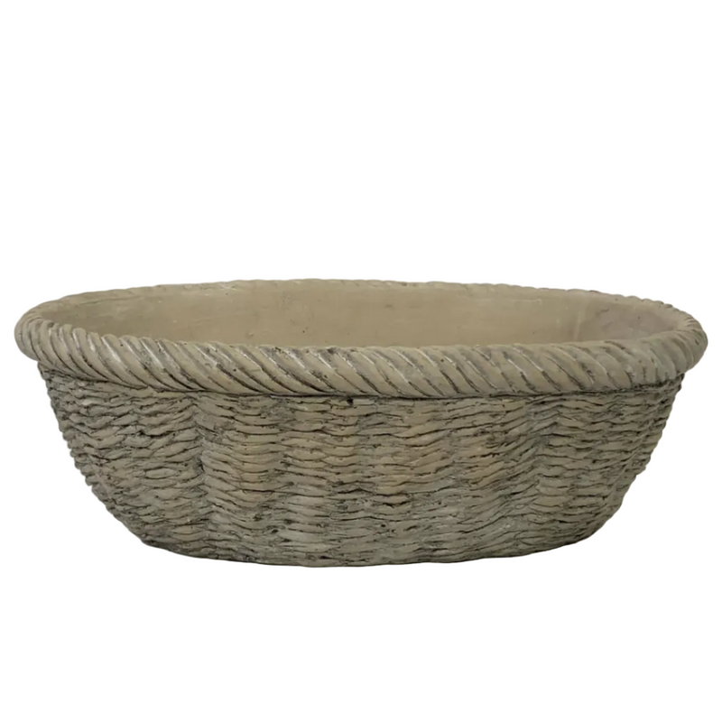 A large oval woven basket with a thick twisted rope border, shown against a plain white background.