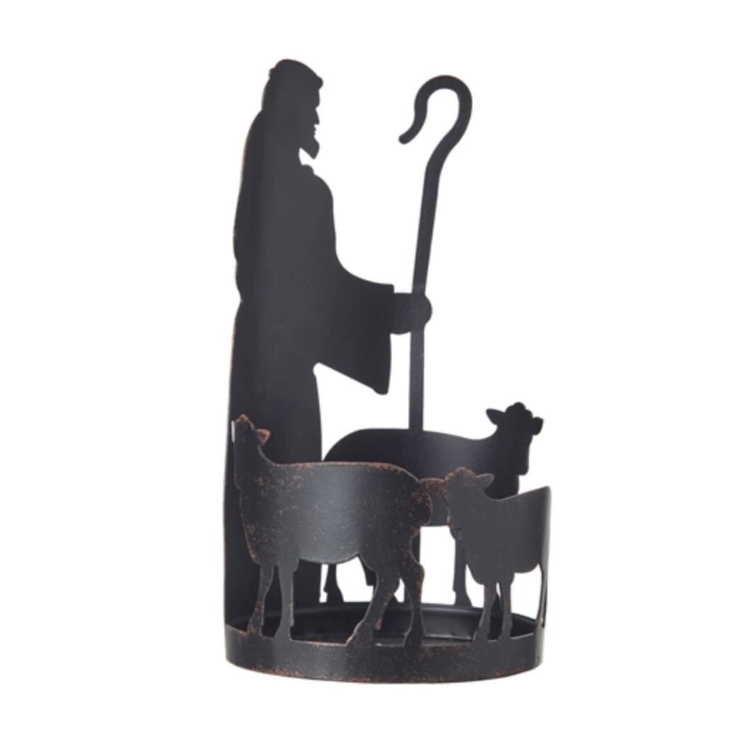 A black metal decorative sculpture of a shepherd holding a staff with sheep and a goat in front, set against a plain white background.