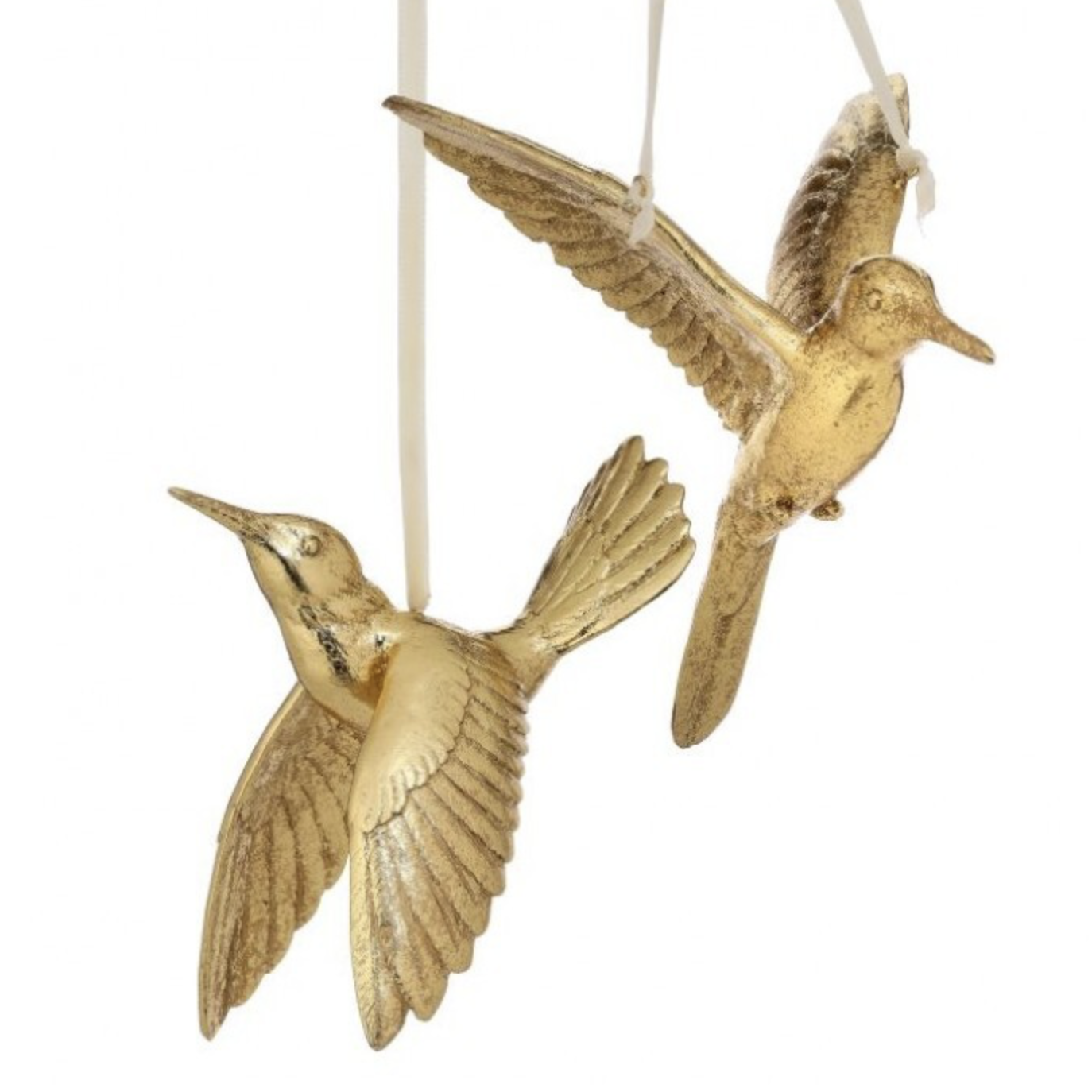 Two metallic gold bird ornaments shaped like flying birds, suspended by thin white strings against a plain white background.