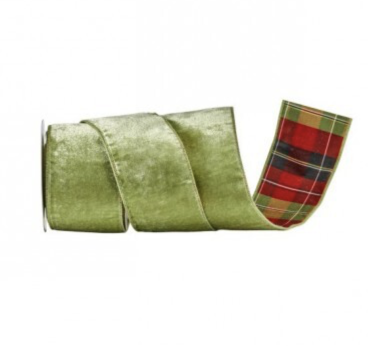 A roll of green velvet ribbon with a red, green, and black tartan plaid pattern visible on the inner side, shown against a plain white background.