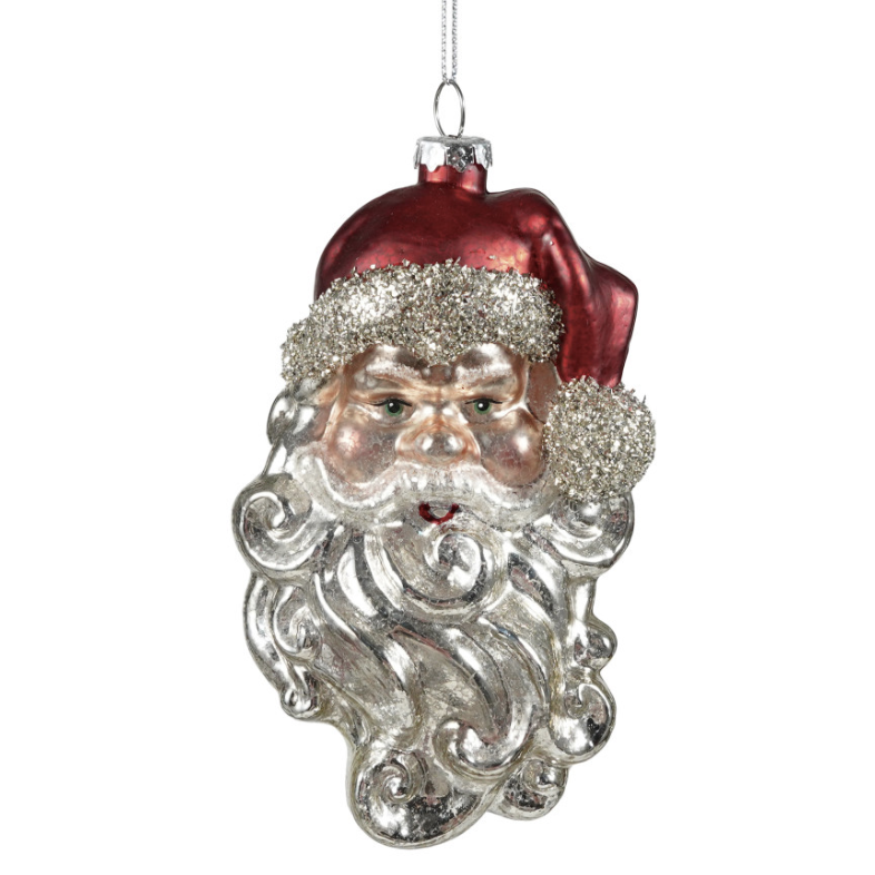 A vintage-style Christmas ornament shaped like Santa's face, featuring a textured silver beard, glittery silver trim, and a red hat, suspended by a silver string against a plain white background.