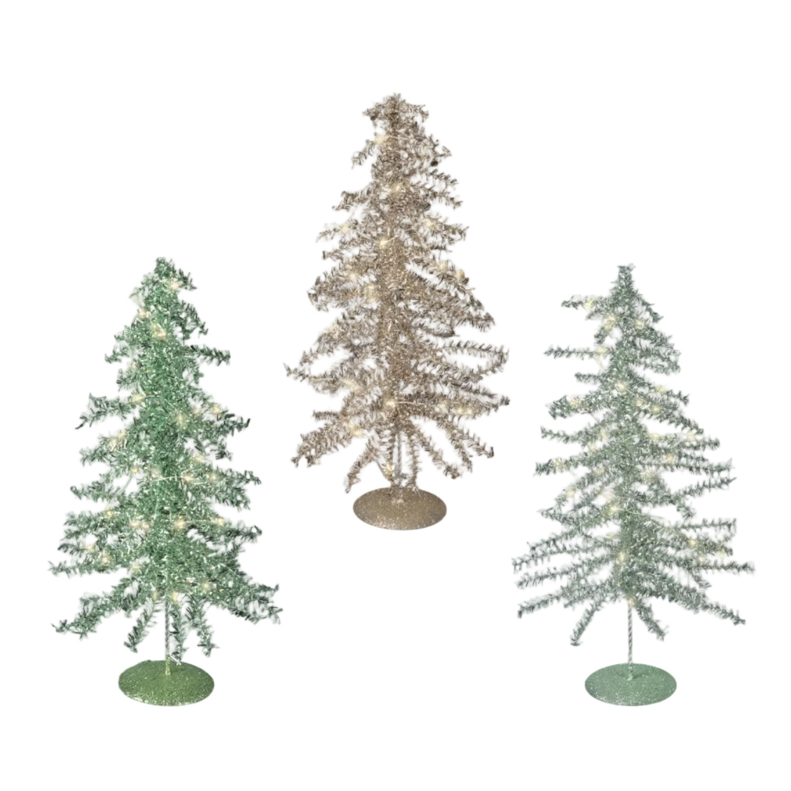 Three artificial Christmas trees on round bases against a white background: one green tree, one glittery gold tree, and one frosted light green tree with warm white lights.