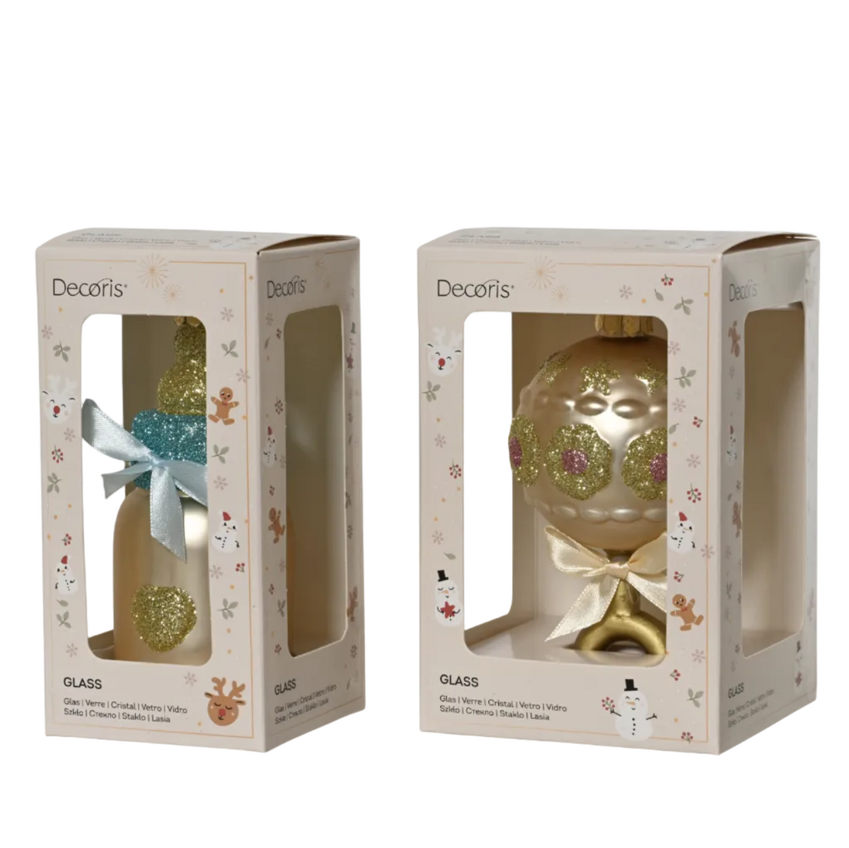 Two Decoris glass Christmas ornament packages shown side by side on a white background. The left package contains a gold ornament with a blue glittery top and a silver bow.