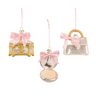 Three decorative hanging ornaments shaped like a gold jewelry box, an open compact mirror with pink powder, and a clear handbag with a pink bow, shown on a white background.