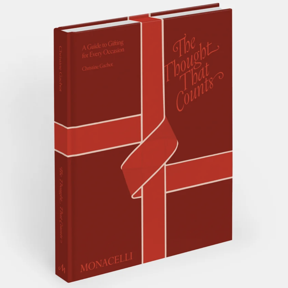 The Thought That Counts: A Guide to Giving for Every Occasion by Christine Goucher, published by Monacelli. The book features a minimalist red and orange design with a ribbon graphic on the cover and spine, set against a clean white background.