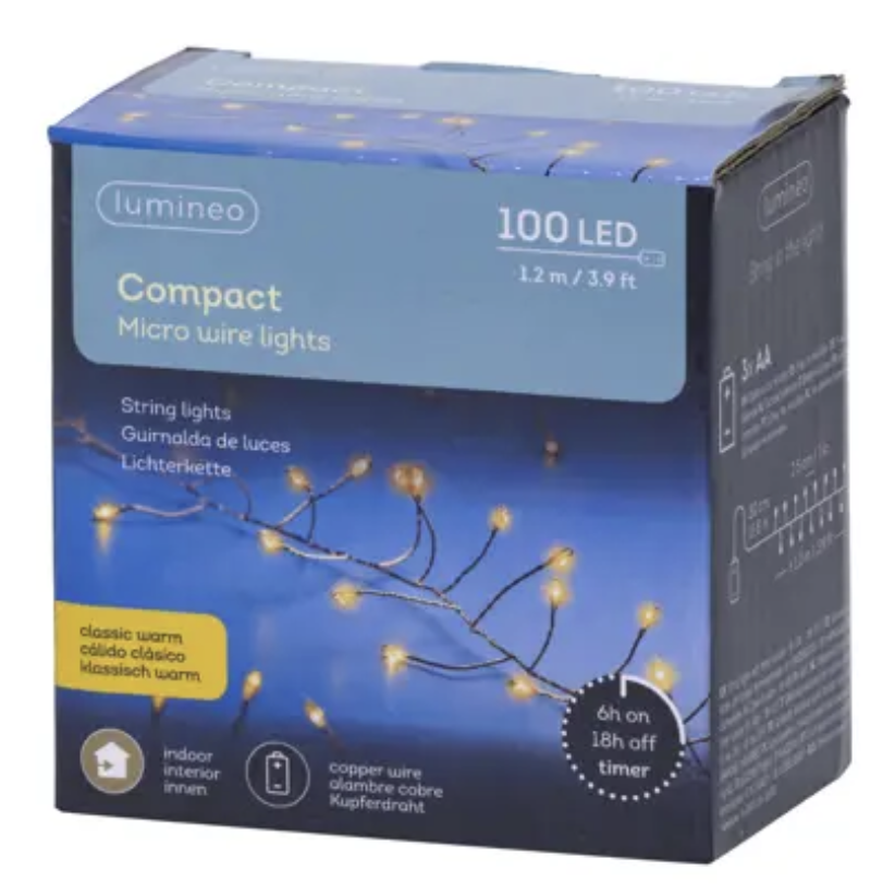 Lumineo Compact 100 LED Micro wire string lights in a blue retail box, featuring warm white glowing lights on a dark blue background.