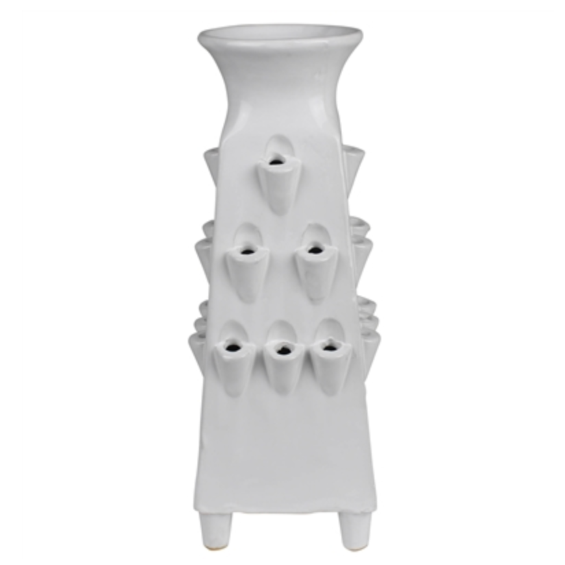 White ceramic vase with textured design on a white background