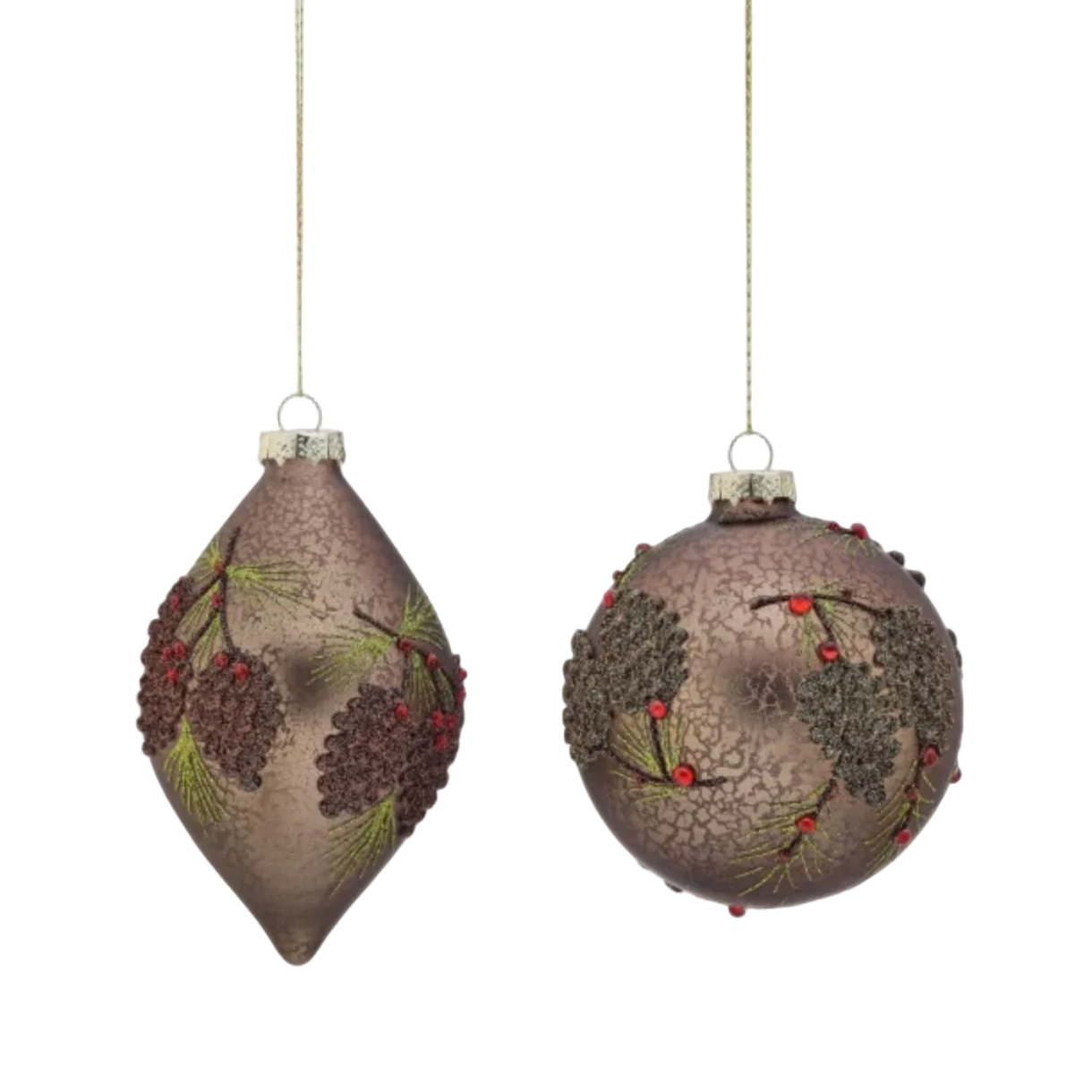 Two decorative Christmas tree ornaments hanging against a plain white background. One ornament is teardrop-shaped and the other is round, both in a metallic bronze finish with embossed pinecones, pine needles, and small red berries.