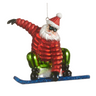 A Santa Claus snowboard ornament featuring a glittery red jacket, green pants, black boots, a red Santa hat with a white pom-pom, and a blue glittery snowboard, shown against a plain white background.