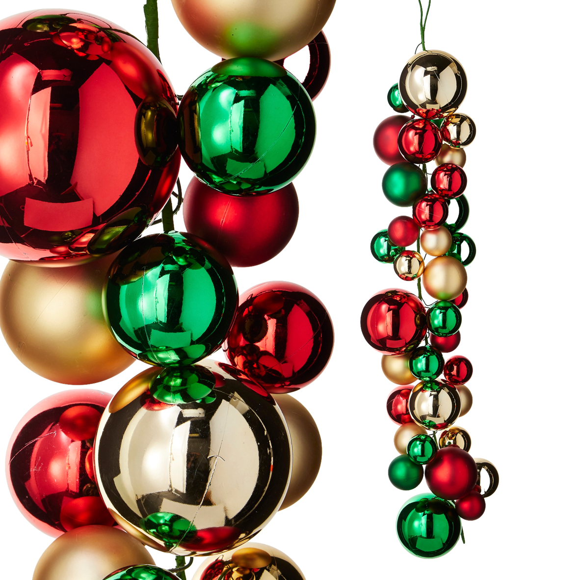 Christmas ornament set with shiny red, green, and gold metallic baubles, shown as a cluster and hanging as a garland on a white background.