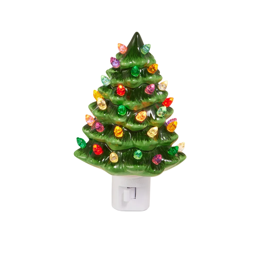 A small green Christmas tree night light with multicolored lights stands next to its white retail box on a clean white background. The box shows the text 'Vintage GREEN TREE NIGHT LIGHT' and the brand 'RAZ imports'.