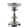 A polished silver metal candle holder with a tiered pedestal design and a wide circular base, shown on a plain white background.