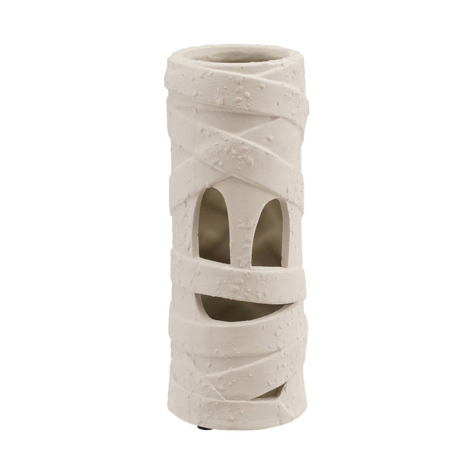 A cylindrical ceramic candle holder with a textured, wrap-like design and cutout details, shown on a plain white background.