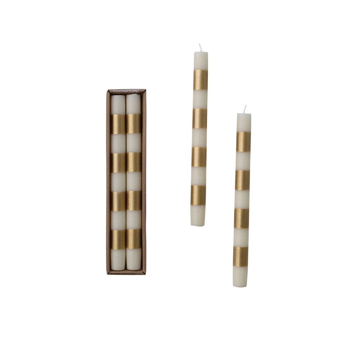 Three striped taper candles with alternating cream and metallic gold bands, shown with two candles standing upright and one set of three in a brown rectangular gift box on a white background.